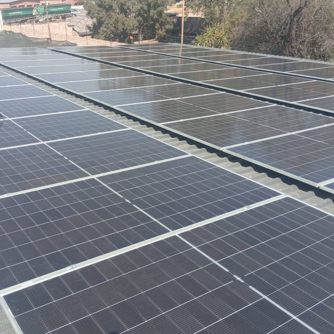 An image of solar panels installed on the roof of a factory by Energilitical Electrical Engineering specialists.