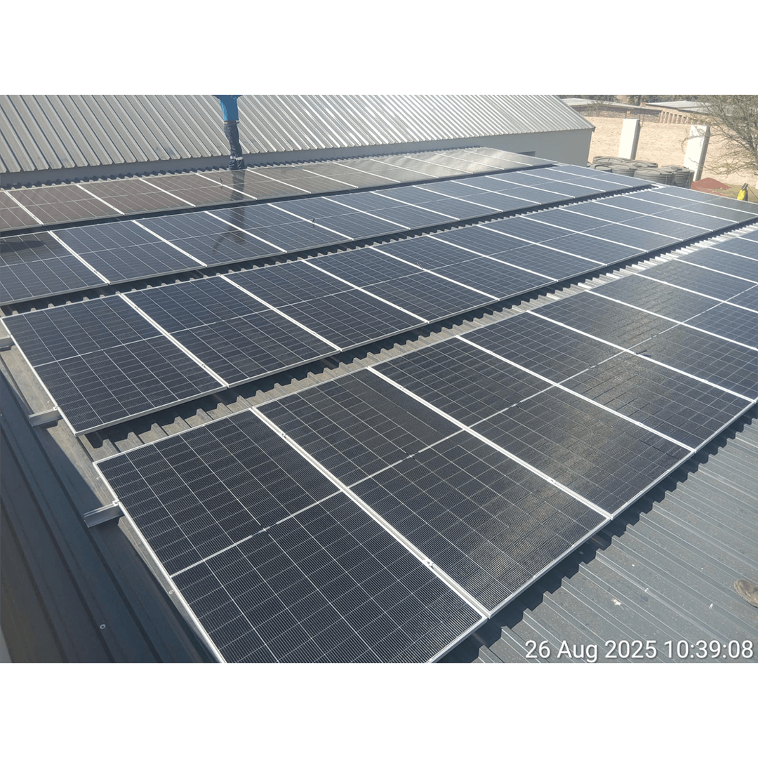 An image of solar panels installed on the roof of a factory by Energilitical Electrical Engineering specialists.