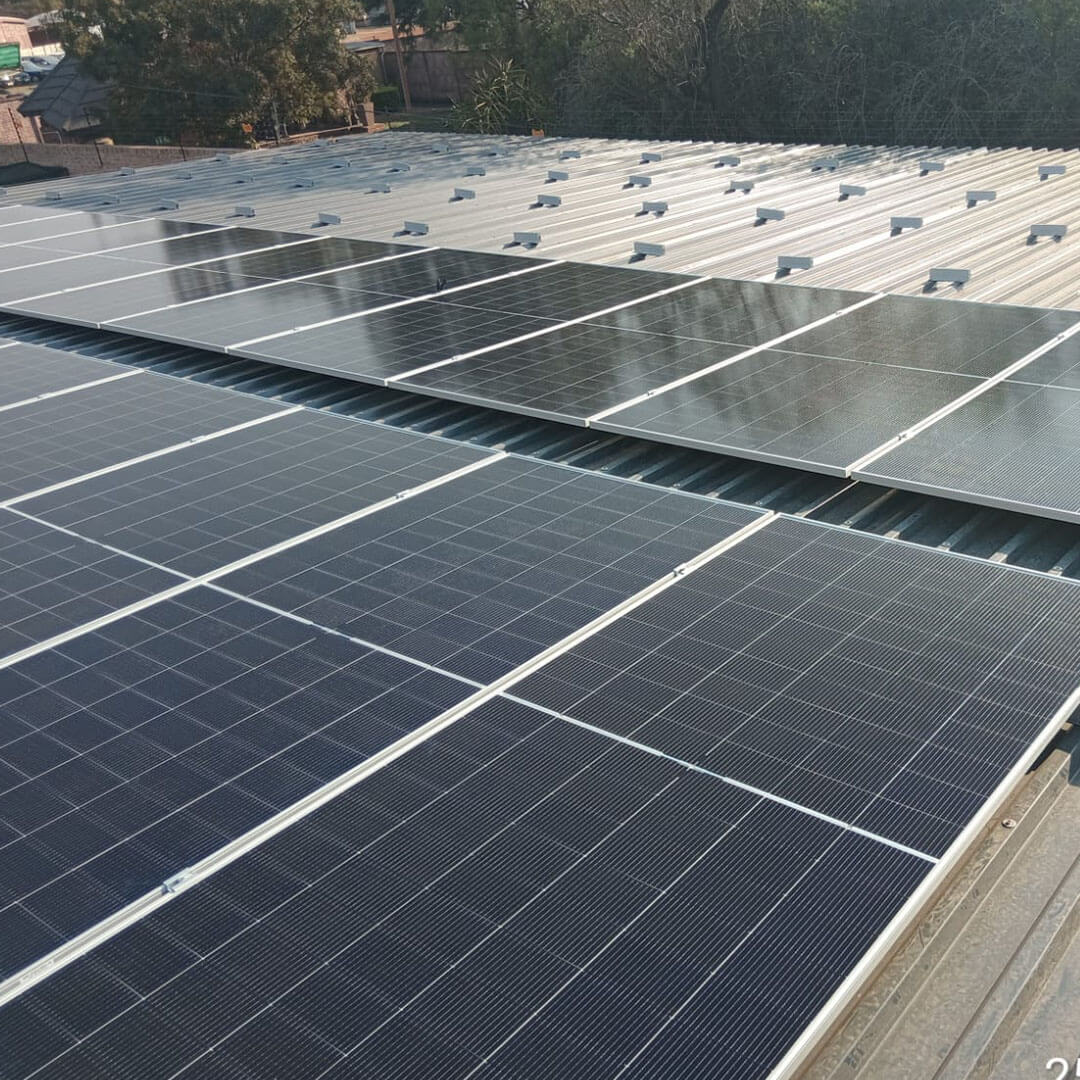 An image of solar panels installed on the roof of a factory by Energilitical Electrical Engineering specialists.