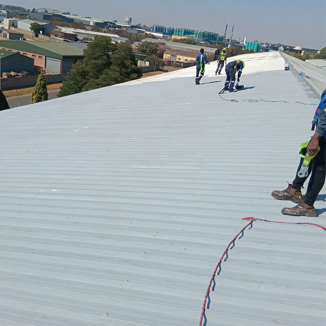 An image of Energilitical engineers preparing a industrial roof for a Solar installation.