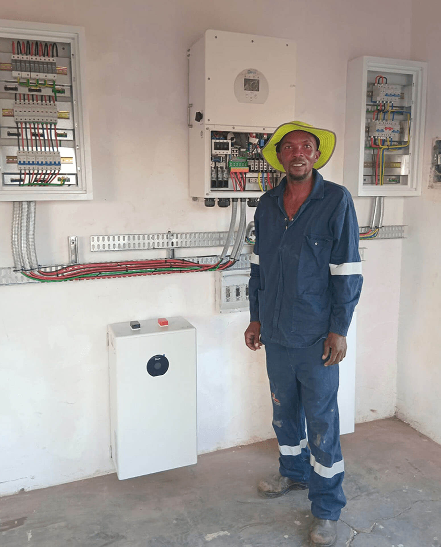 An image of Energilitical engineers installing Solar panlels and inverters for an industrial company.