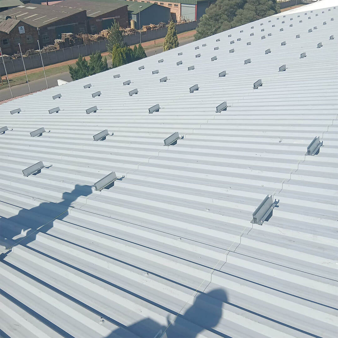 An image of Energilitical engineers preparing a industrial roof for a Solar installation.