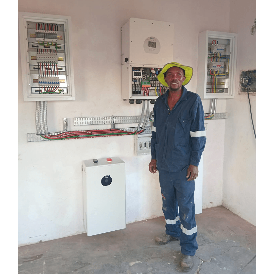 An image of Energilitical engineers installing Solar panlels and inverters for an industrial company.